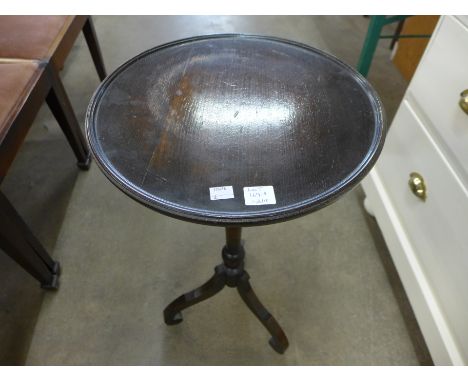 A mahogany tripod wine table