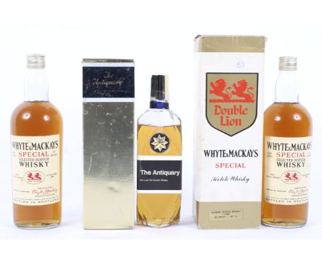 The Antiquary De Luxe Old Scotch Whisky, 26 2/3 fl. oz., 70 proof, boxed, and two bottles of Whyte &amp; Mackays Double Lion 