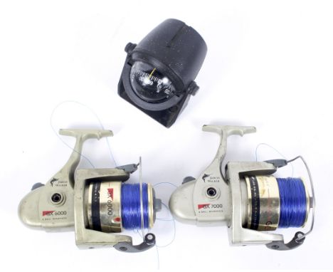 Two Jarvis Walker GX fixed spool sea fishing reels (A/F) and a vintage Aqua Meter (USA) water-filled boat compass