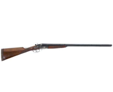 A Sarasqueta side by side 12 gauge hammer action shot gun, serial number 55443, 1/2 and full choke 