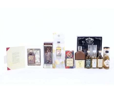 A group of miniatures including a Whyte &amp; Mackay ceramic Grizzly Bear, 5 cl., 40% Vol., Highland Glen Deveron single malt