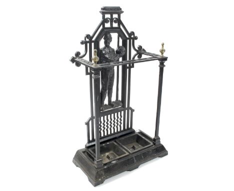 A cast metal 'Footballer' stick stand, with two removable inserts, with brass finial's, cast with a footballer to pierced bac