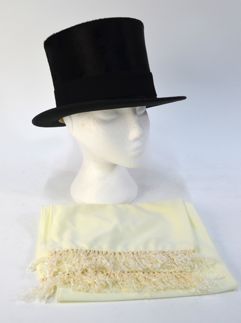 A black silk top hat retailed by Christys', London, 56 cm circ., 20 cm