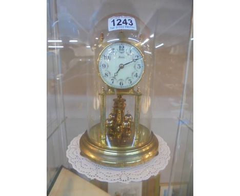 An anniversary clock under dome, COLLECT ONLY, in working order. 