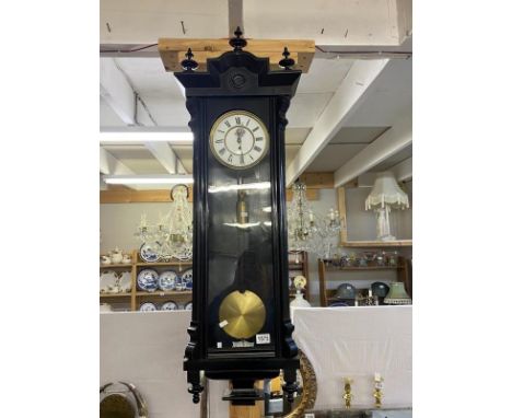 A black carved Vienna single weight wall clock 