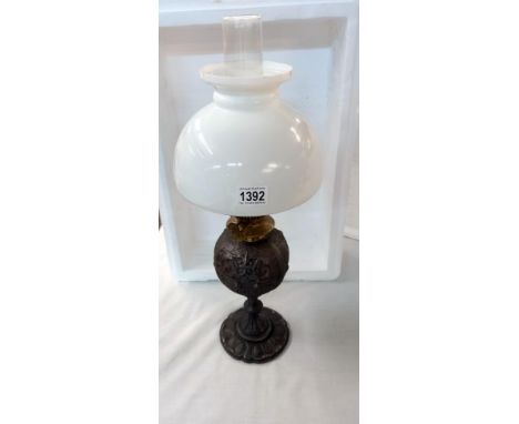 An oil lamp 19th century cast iron with later shade, Shade A/F 