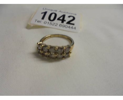 A 1.7 carat yellow gold diamond cluster ring, size N, 2.77 grams. 