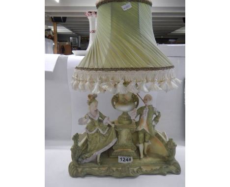 A Regency figure group table lamp with shade, (chip to right side), COLLECT ONLY. 