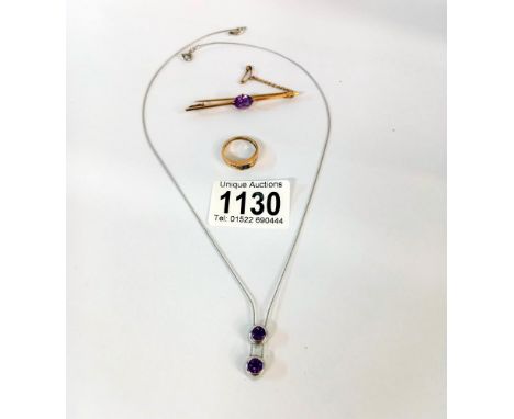 A 10ct gold ring with blue stone (2.64gms). A 15ct gold bar brooch with amethyst (4.97gms) &amp; a white gold &amp; amethyst 