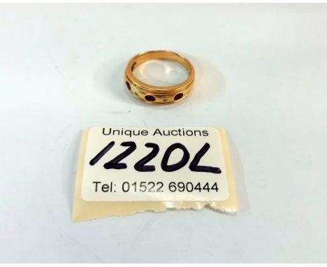 An 18ct gold ring with gems (total weight 4.95gm)Size Q