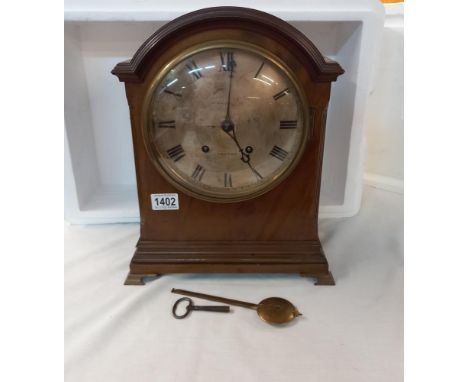 A 19th century bracket clock with silvered dial 