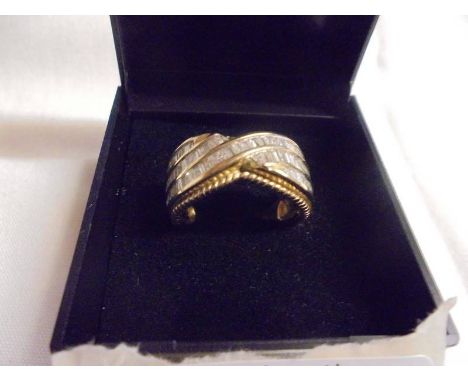 A 1.5 ct diamond princess and channel cut diamond ring, size O, 5.45 grams. 