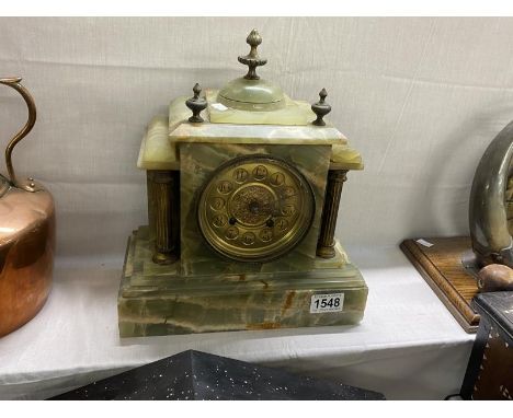 A green onyx mantel clock 