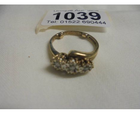 A three stome diamond yellow gold ring, size O half, 3.27 grams. 