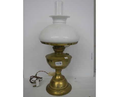 An old brass oil lamp complete with shade. COLLECT ONLY. 