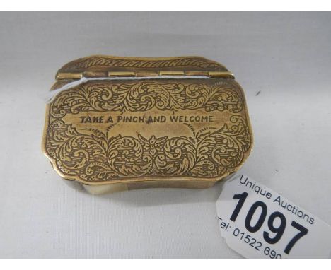 A 19th century brass snuff box inscribed 'Take a Pinch and Welcome'. 