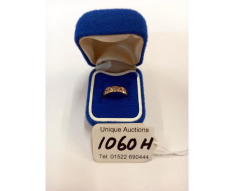 A white stone set band ring in 9ct gold hallmarked Birmingham (1994) 