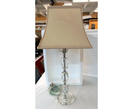 A modern glass base lamp with shade 