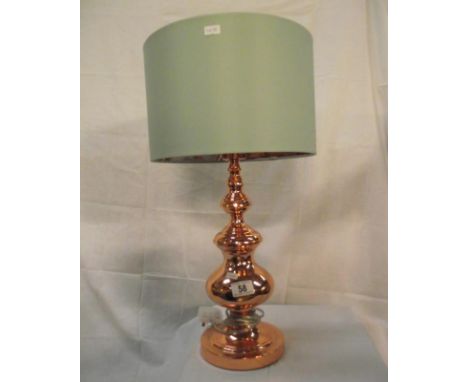 An ornate copper table lamp with green shade (copper design inside shade) 
