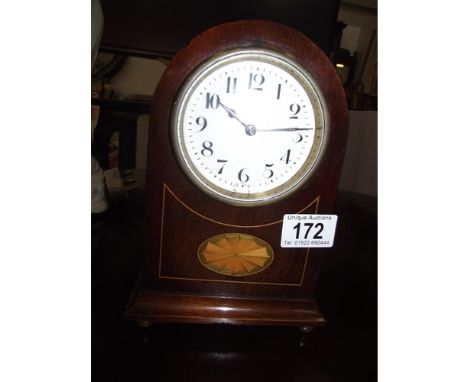 A small French enamel faced clock with key (enamel slightly a/f)