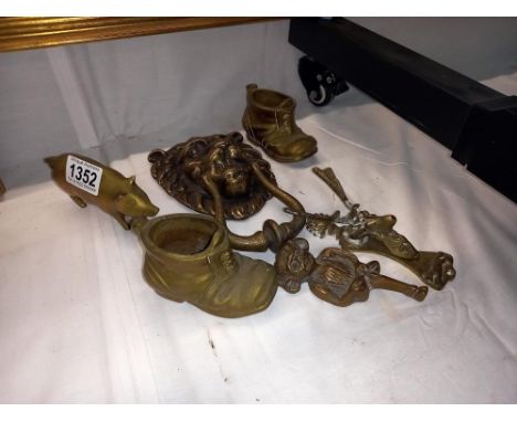 A good collection of brassware items including large Lion header knocker, Antelope knocker and Imp 