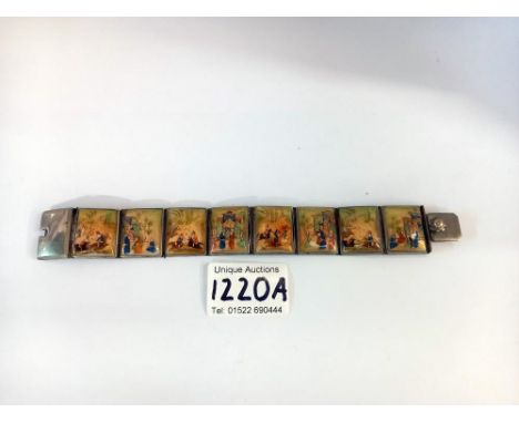 A Persian /Chinese  silver plated enamel panel bracelet composed of 8 panels. 2 panels have some enamel loss 