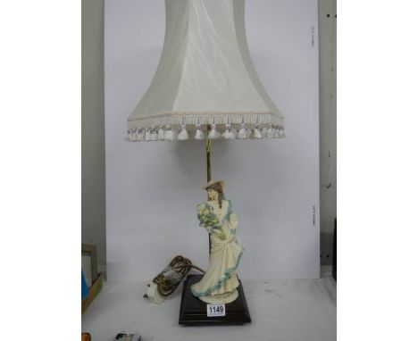 A modern figural table lamp. 