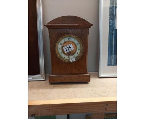 An Edwardian oak mantle clock COLLECT ONLY