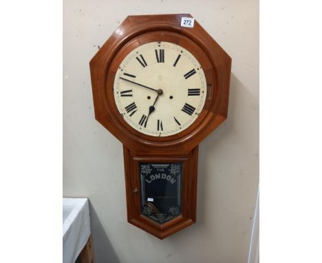 A wall clock with painted 'The London' advertising COLLECT ONLY