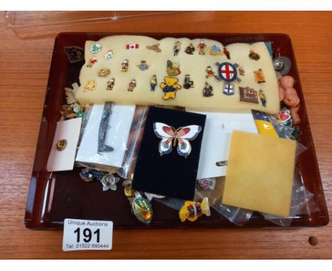 A quantity of pin badges including enamel butterfly etc