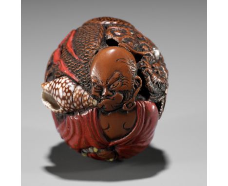 AN UNUSUAL LACQUERED AND INLAID KURUMI (WALNUT) NETSUKE OF RAKAN HANDAKA SONJAUnsignedJapan, 19th centuryIntricately carved, 