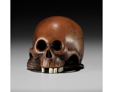 TOMOHISA: A LARGE WOOD NETSUKE OF A SKULL WITH HOSSUBy Tomohisa, signed Tomohisa 友久Japan, Edo (Tokyo), second half of 19th ce