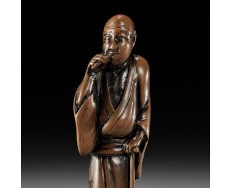 HOKYUDO ITSUMIN: A FINE WOOD NETSUKE OF A BLIND MAN CLEANING HIS TEETHBy Hokyudo Itsumin (active 1830-1870), signed Hokyudo I