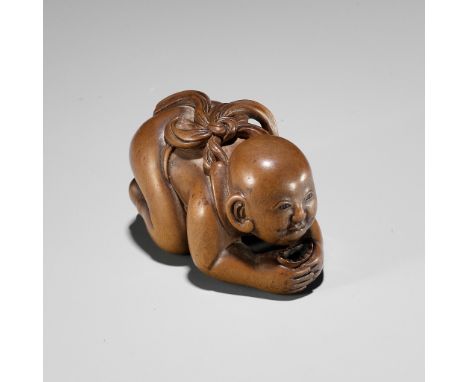 CHIKUUNSAI: A WOOD NETSUKE OF A BABY BOY EATING MOCHIBy Chikuunsai, signed Chikuunsai 竹雲齋Japan, Yamada, Ise Province, 19th ce