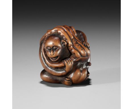 MASAKAZU: A FINE AND AMUSING WOOD NETSUKE OF A MONKEY AND OCTOPUSBy Masakazu, signed Masakazu 正一Japan, Gifu or Nagoya, c. 186