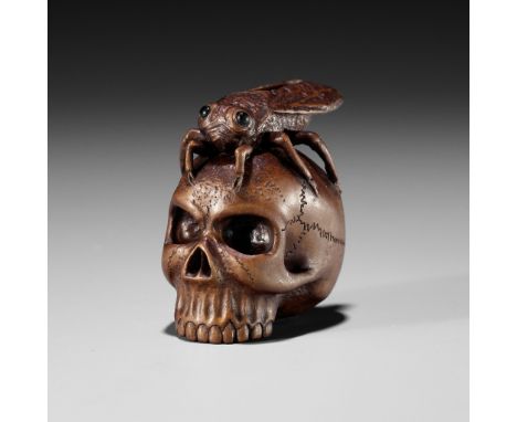 ALEXANDER DERKACHENKO: A WOOD NETSUKE OF A CICADA ON A SKULLBy Alexander Derkachenko, signed with the artist's markUkraine, 2