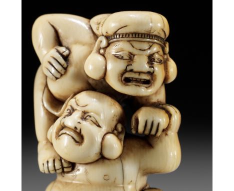 AN IVORY NETSUKE OF HOTEI AND DAIKOKU WRESTLINGUnsignedJapan, 18th century, Edo period (1615-1868)Published: Sagemonoya (2022