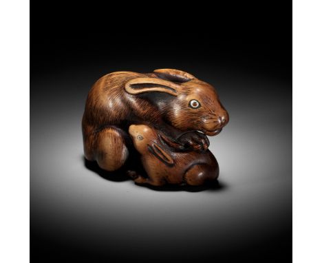 YAMAGUCHI OKATOMO: A SUPERB WOOD NETSUKE OF A HARE AND YOUNGBy Yamaguchi Okatomo, signed Okatomo 岡友Japan, Kyoto, late 18th ce