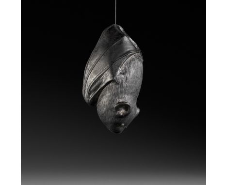 A RARE EBONY NETSUKE OF A BATUnsignedJapan, 19th century, Edo period (1615-1868)Finely carved in the manner of Horaku to depi