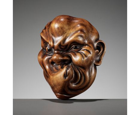 A LARGE WOOD MASK NETSUKE OF USOFUKIUnsigned Japan, 19th centuryWell carved with an amusing expression, the elongated lips pu