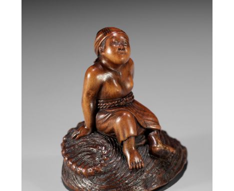 MASAKATSU: A RARE WOOD NETSUKE OF A CLAM DIVER RESTING ON A LARGE AWABI SHELLBy Suzuki Masakatsu, signed Masakatsu 正勝 with ka