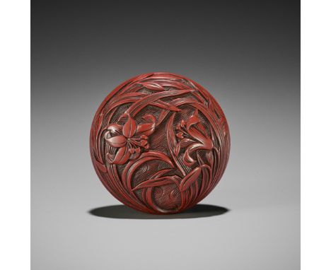 A FINE TSUISHU (CARVED RED LACQUER) MANJU NETSUKE WITH LILIESUnsignedJapan, late 18th to early 19th century, Edo period (1615