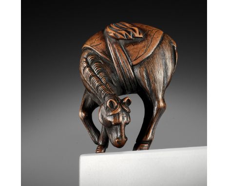 A FINE WOOD NETSUKE OF A GRAZING HORSEUnsignedJapan, 18th century, Edo period (1615-1868)The horse depicted in a typical post