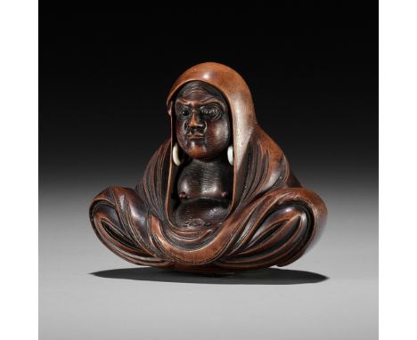 SHUGETSU SHIZAN: A LARGE WOOD NETSUKE OF DARUMABy Shugetsu, signed Shugetsu Shizan 舟月 紫山 saku 作Japan, Edo (Tokyo), mid-19th c