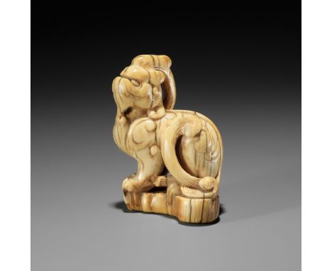 A LARGE AND RARE IVORY TOBORI NETSUKE OF A MYTHICAL BEASTUnsignedJapan, 17th century, Edo period (1615-1868)Published: Sagemo