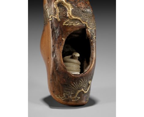 TOYO: A RARE AND UNUSUAL LACQUERED ROOT WOOD NETSUKE OF A SNAKE INSIDE A PINE TREEKanshosai Toyo lineage, signed Toyo 桃葉 and 