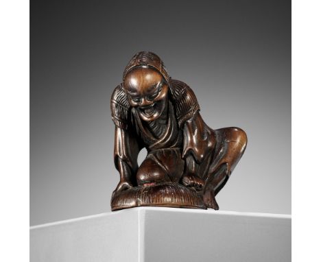 AN EDO SCHOOL WOOD NETSUKE OF A HUNTER TRAPPING A GOOSEUnsignedJapan, Edo (Tokyo), 18th century, Edo period (1615-1868)Finely