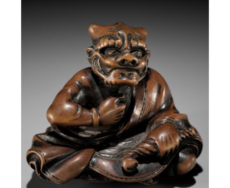 MASAYUKI: A FINE WOOD NETSUKE OF A SMOKING ONIBy Hoshunsai Masayuki, signed Masayuki 正之 with kakihanJapan, Edo (Tokyo), mid-1