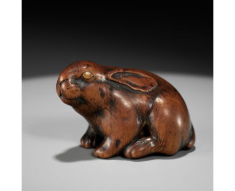 MASAKATSU: A SUPERB WOOD NETSUKE OF A PIEBALD HARE WITH AMBER EYESBy Suzuki Masakatsu, signed Masakatsu 正勝Japan, Yamada, Ise 