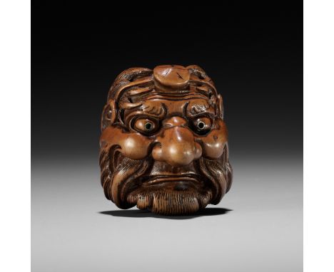 HIDARI ISSAN: A RARE WOOD MASK NETSUKE OF SOJOBO, THE TENGU KING OF MOUNT KURAMABy Hidari Issan (1804-1857), signed Hidari Is